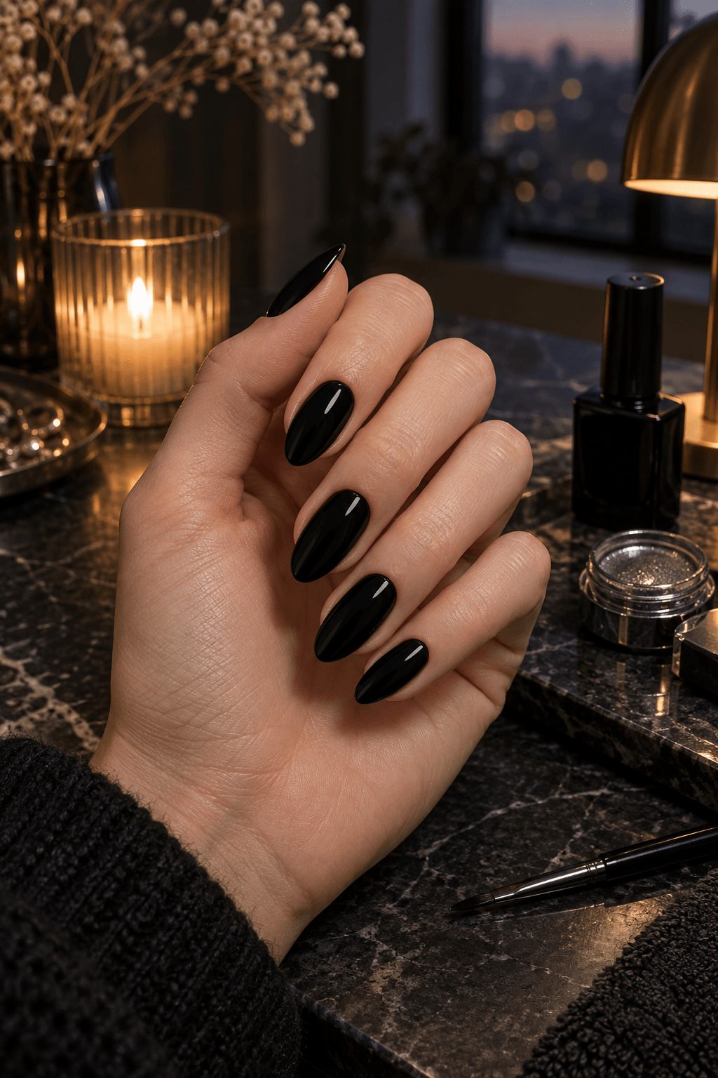 Even black almond nails prepared beside gunmetal chrome powder